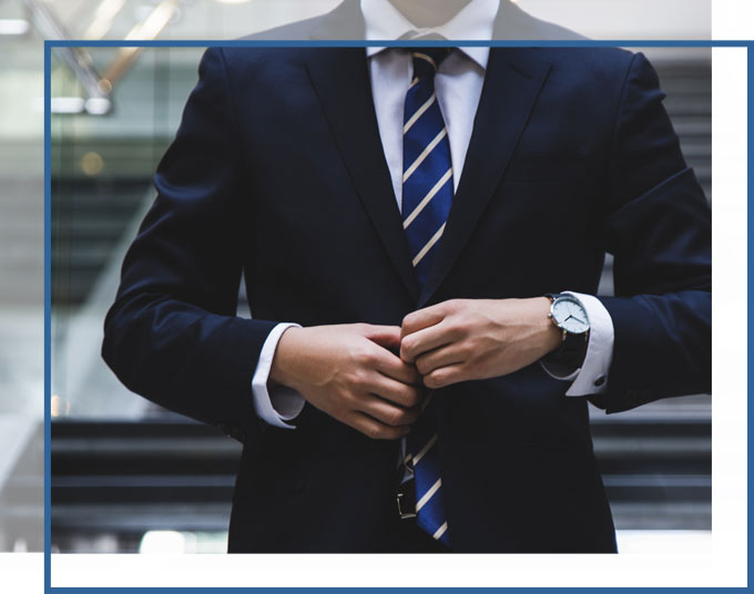 community-association-law-covenant-rule-enforcement-gadc-florida-attorneys Man Buttoning Suit | Community Association Law & Covenant Rule Enforcement Attorneys GD&C Law