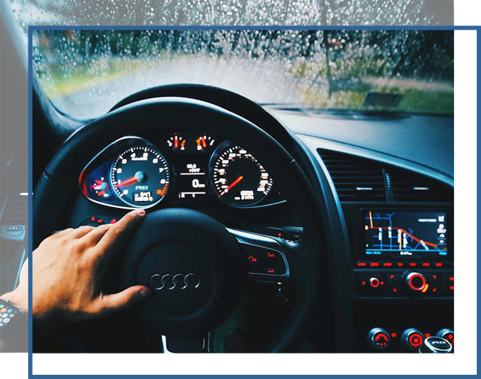 personal-injury-attorneys-car-accident-florida-gadc-law Driver at wheel of a car on a rainy day | Personal Injury Car Accident Attorneys of GD&C Law