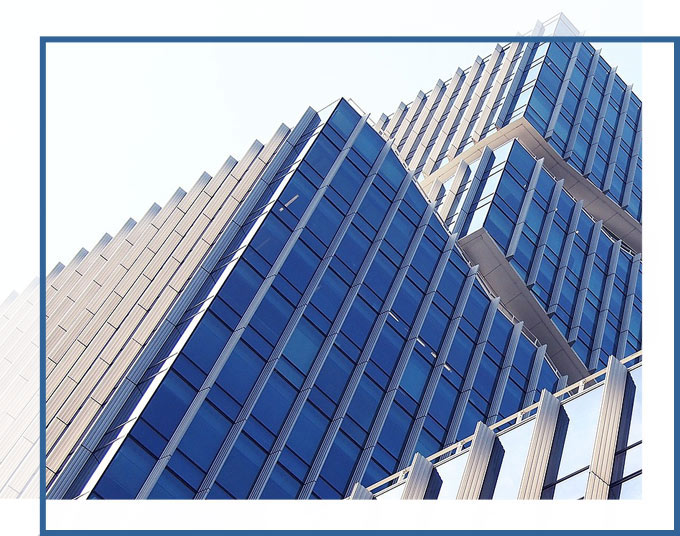 Hands rise building shot at an angle | Real Estate Commercial and Industrial Leasing Services from the Attorneys of GD&C Law