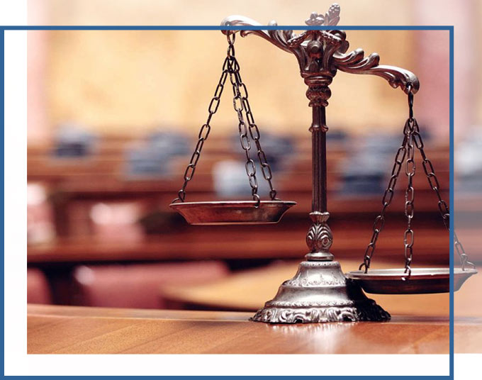 Scales of Justice sitting on the table of a courtroom | Trust & Estate Litigation Lawyers GD&C Law